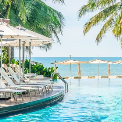 Umbrella with chair in hotel  swimming pool resort